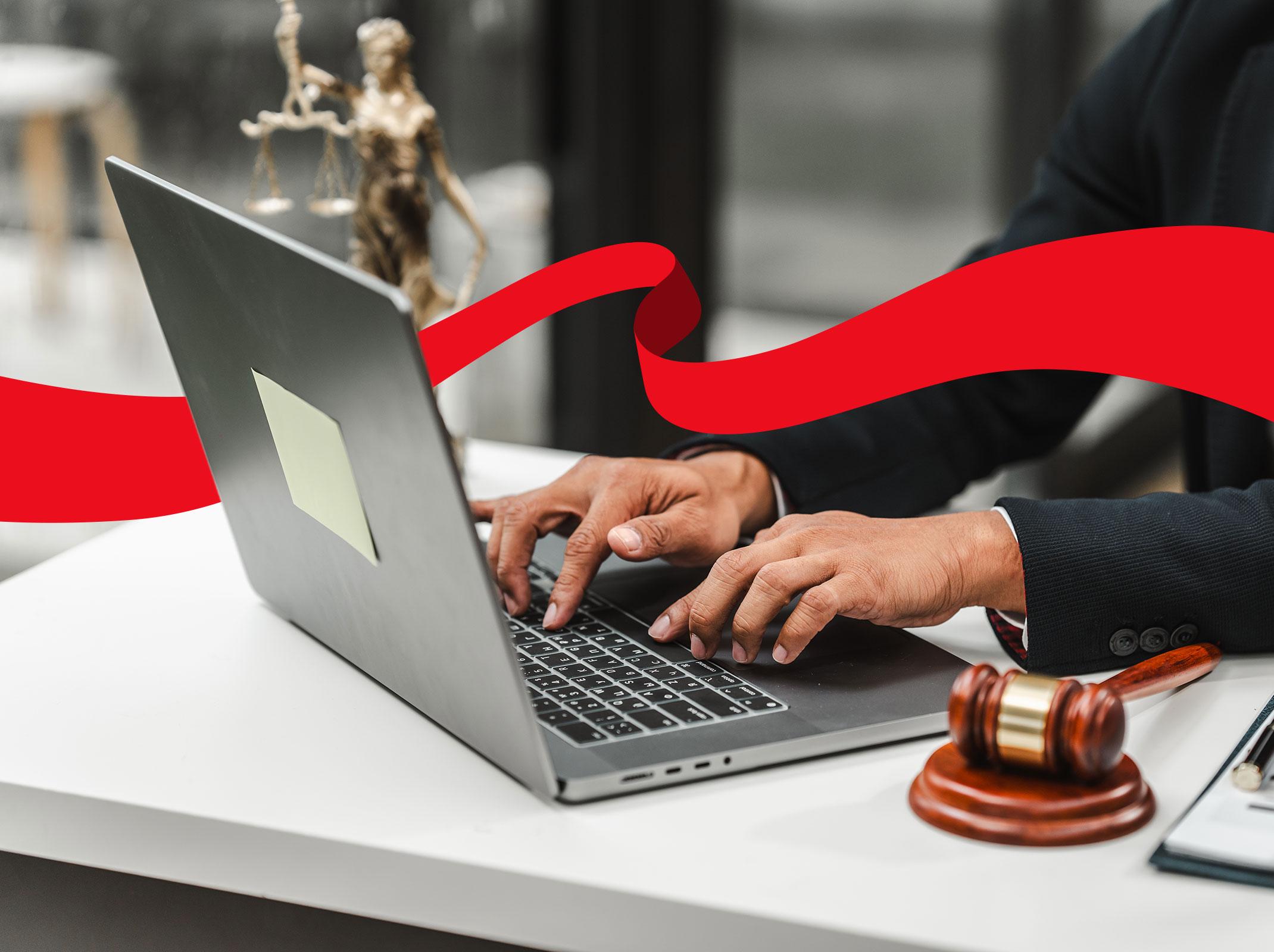 Woman typing on laptop in a legal setting