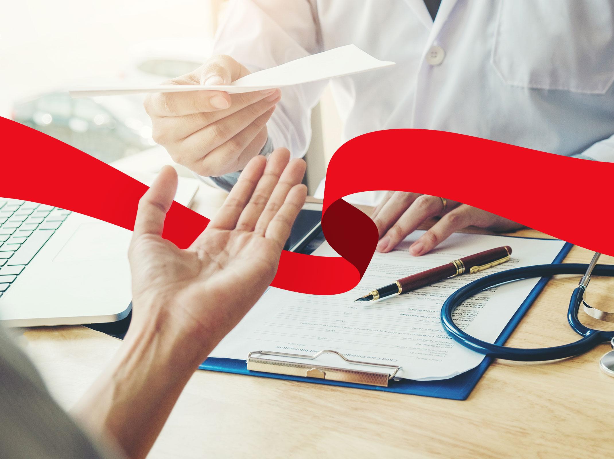 Doctor handing a medical leave form to a patient