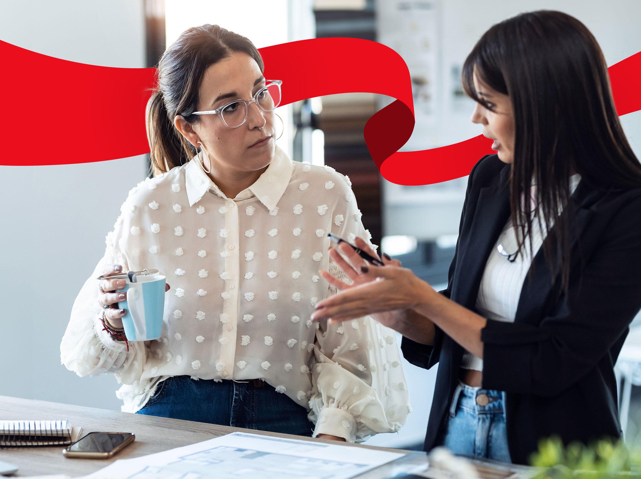 Two women talking in an office