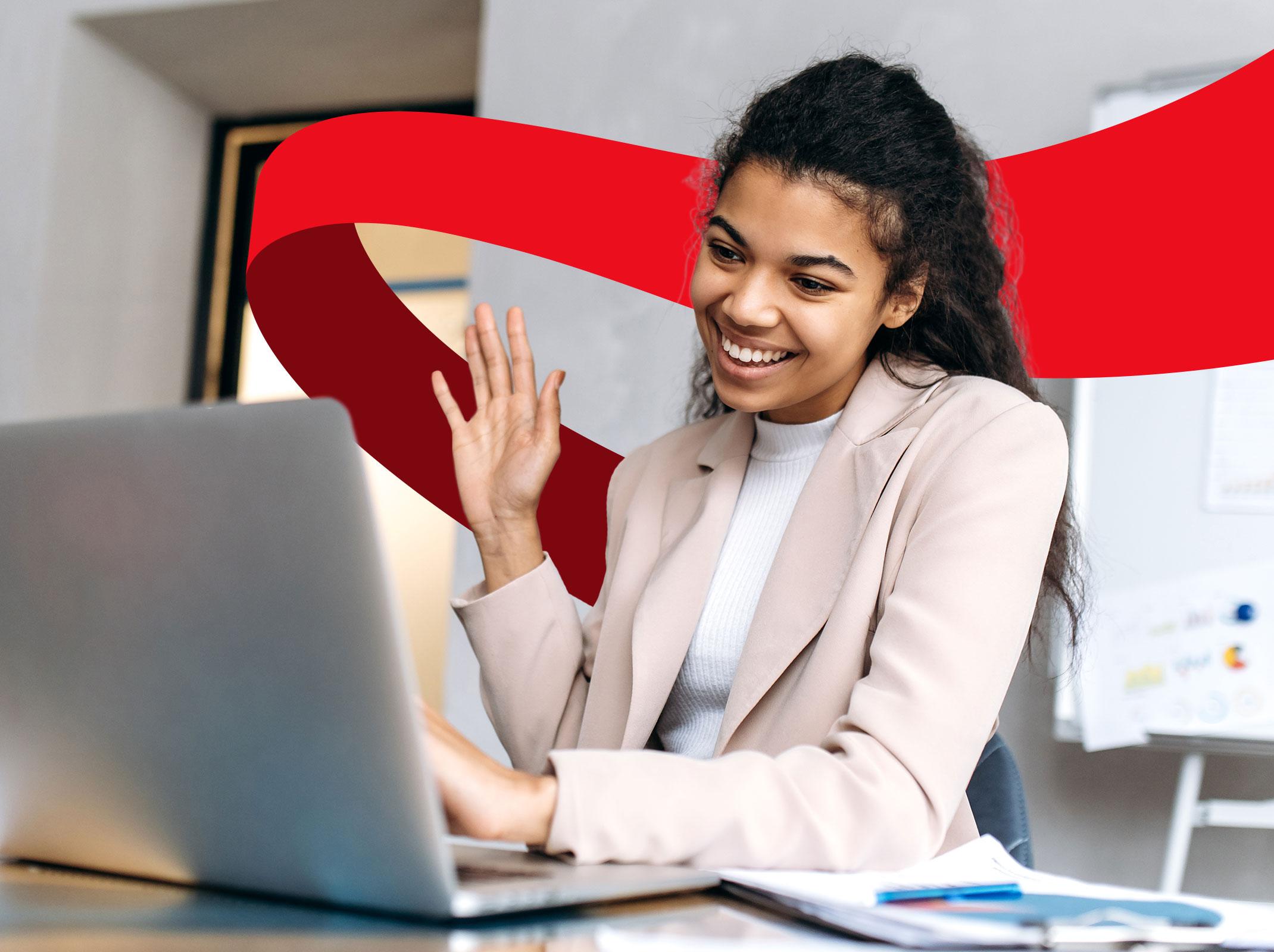 Smiling professional woman working on laptop